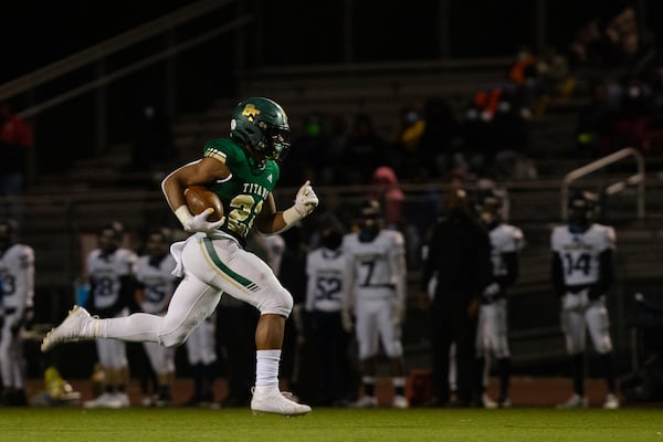 Justice Haynes (22) sophomore running back for Blessed Trinity, sprints to the end zone against Decatur High School during the second-round playoff game Friday, Dec. 4, 2020, in Roswell. Blessed Trinity won 44-0. (Christina Matacotta/For the AJC)