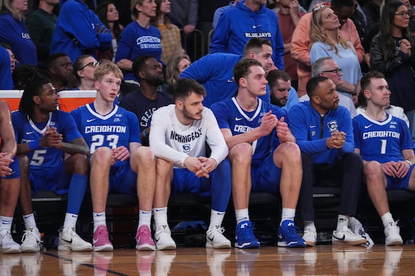 Creighton's Jamiya Neal (5), Jackson McAndrew (23) and Steven Ashworth (1) watch during the second half of an NCAA college basketball game against the St. John's in the championship of the Big East Conference tournament Saturday, March 15, 2025, in New York. (AP Photo/Frank Franklin II)