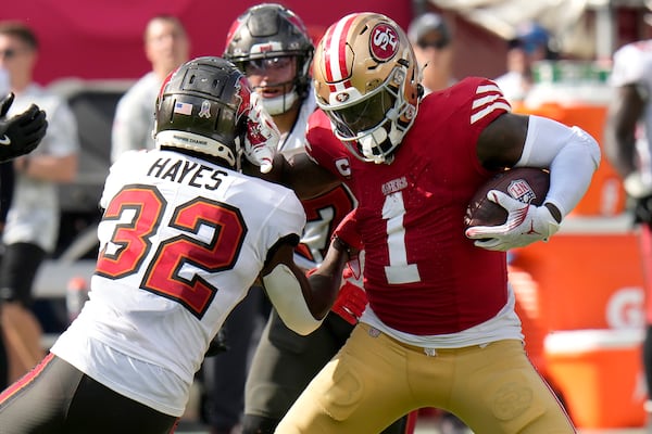 San Francisco 49ers wide receiver Deebo Samuel Sr. (1) runs against Tampa Bay Buccaneers safety Josh Hayes (32) during the second half of an NFL football game in Tampa, Fla., Sunday, Nov. 10, 2024. (AP Photo/Chris O'Meara)