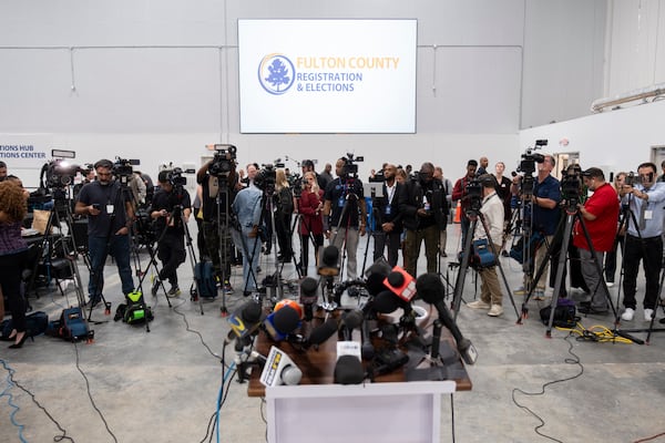 Journalists gather for a briefing at the Fulton County election hub in Fairburn after the close of polls Tuesday. Ben Gray for The Atlanta Journal-Constitution