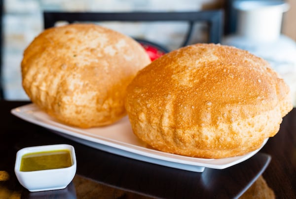 Scallion Bubble Pancakes, shown with curry sauce, come in handy for sopping up any sauce you’re enjoying at Fire Stone Chinese. CONTRIBUTED BY HENRI HOLLIS