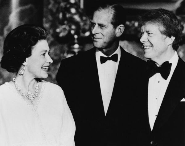 Queen Elizabeth II and Prince Philip (centre) with US President Jimmy Carter in the Blue Drawing Room at Buckingham Palace, London, 10th May 1977. Carter and other NATO heads of state are attending a dinner at the palace during the 1977 London summit