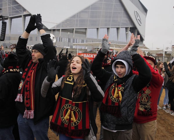 Cheering fans near Mercedes-Benz Stadium