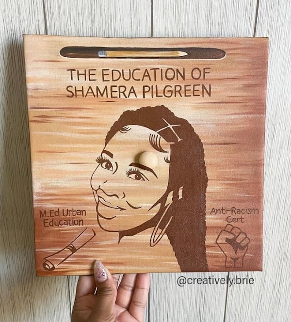 Bria Bowen of Kennesaw made a business out of designing and decorating custom graduation caps for students. She often paints portraits of the graduate and features their loved ones, hobbies or career goals. For the spring 2023 graduation season, her company, Creatively Brie, received about 30 custom orders. (Courtesy of Bria Bowen)