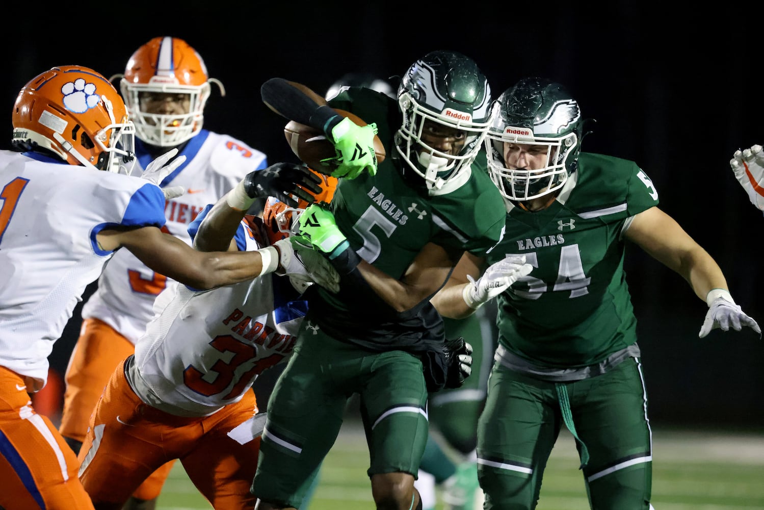 Dec. 11, 2020 - Suwanee, Ga: Collins Hill wide receiver Sean Norris (5) fights for extra yards against Parkview with help from Collins Hill offensive lineman Lucas Kulig (54) in the first half of the Class AAAAAAA quarterfinals game at Collins Hill high school Friday, December 11, 2020 in Suwanee, Ga.. JASON GETZ FOR THE ATLANTA JOURNAL-CONSTITUTION