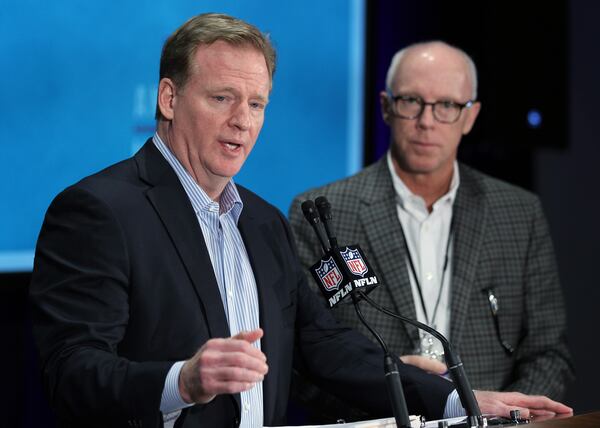 NFL Commissioner Roger Goodell, left, talks as Atlanta Falcons President and co-chairman of the NFL's competition committee Rich McKay, right, looks on during a press conference at the NFL owners meeting in Boca Raton, Fla., Wednesday, March 23, 2016. (AP Photo/Luis M. Alvarez)