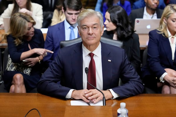 Dr. Mehmet Oz, President Donald Trump's pick to lead the Centers for Medicare and Medicaid Services, sits before testifying at his confirmation hearing before the Senate Finance Committee, on Capitol Hill in Washington, Friday, March 14, 2025. (AP Photo/Ben Curtis)