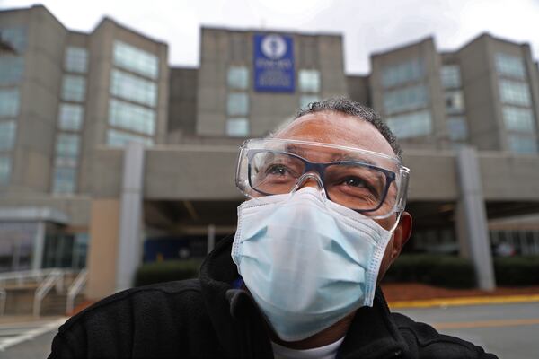 Reggie Pitts, a lead transportation attendant at Emory Saint Joseph’s Hospital, was deeply hesitant about getting a vaccine. Pitts changed his mind and was recently vaccinated. “Now that I’ve done it, I’m really glad I’ve done it,” he said. “I think I’ve influenced some people in my department to get it done, too.” (Curtis Compton / Curtis.Compton@ajc.com)