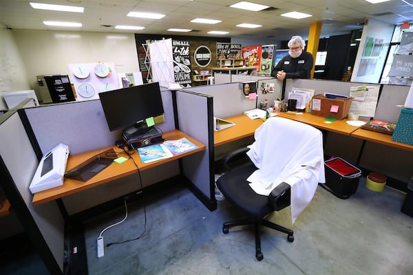 Owner Keith Schroeder pauses in what he calls an eerily quiet sales and marketing department at his business High Road Ice Cream on Tuesday, March 31, 2020, in Marietta. The department is normally bustling with 16 employees who are all now working from home. (Photo:    Curtis Compton / ccompton@ajc.com)