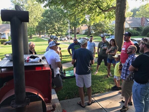 Mitch Benjamin of the award-winning Meat Mitch competitive barbecue team, and team member Bruce Trecek, share competition barbecue tips with local chefs Charles d'Ablaing, Michael Foust of The Farmhouse, Vaughn Good and chef de cuisine Jamie Everett of Hank Charcuterie in Lawrence, Kan., on August 17, 2017. (Jill Wendholt Silva/Kansas City Star/TNS)