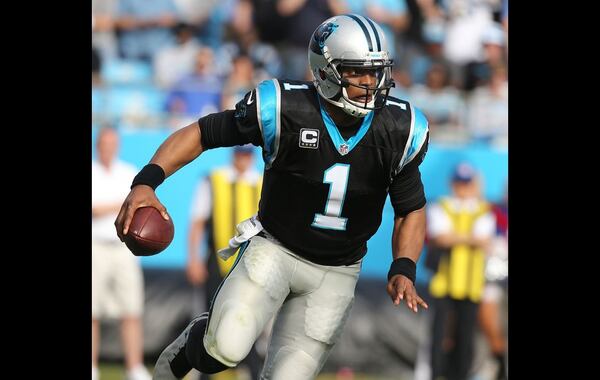 CHARLOTTE: Panthers quarterback Cam Newton runs for yardage against the Falcons during the first half in a football game on Sunday, Dec. 13, 2015, in Charlotte. Curtis Compton / ccompton@ajc.com