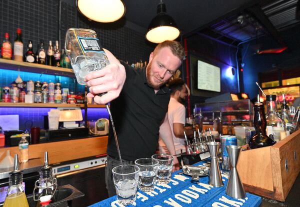 Russell Donovan pours a drink at Joystick Gamebar on Edgewood Avenue on Saturday, April 30, 2022. (Hyosub Shin / Hyosub.Shin@ajc.com)