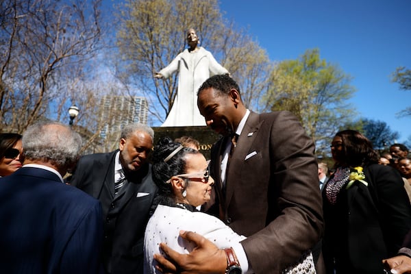 Xermona Clayton is congratulated by Atlanta Mayor Andre Dickens moments after the unveiling of her statue on Wednesday, March 8, 2023. 
Miguel Martinez /miguel.martinezjimenez@ajc.com
