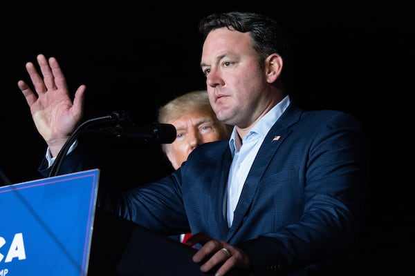 Georgia lieutenant gubernatorial candidate and Republican state Sen. Burt Jones speaks at a rally as former U.S. President Donald Trump watches on Sept. 25, 2021 in Perry, Georgia. (Sean Rayford/Getty Images/TNS)