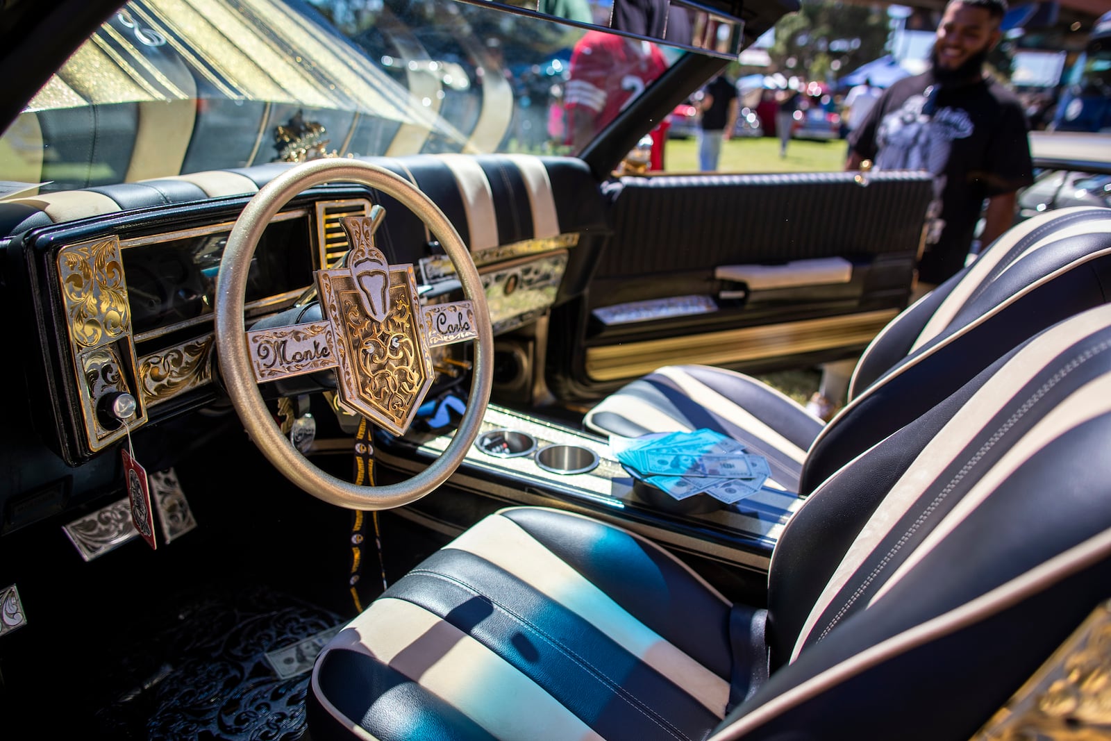 The decorated interior of a Monte Carlo vintage car is pictured during a lowrider exhibition for the 20th anniversary of Lincoln Park in El Paso, Texas, Sunday, Sept. 22, 2024. (AP Photo/Andrés Leighton)