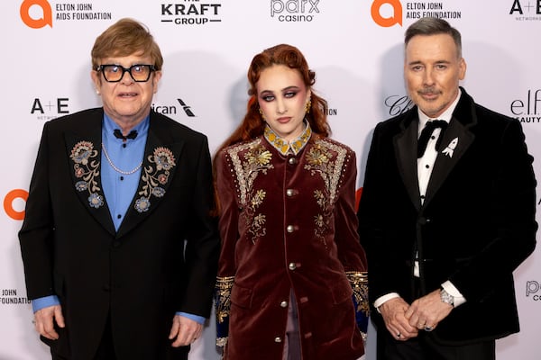 Elton John, from left, Chapell Roan and David Furnish arrive at the 33rd Annual Elton John AIDS Foundation Academy Awards Viewing Party on Sunday, March 2, 2025, in West Hollywood, Calif. (Photo by Willy Sanjuan/Invision/AP)