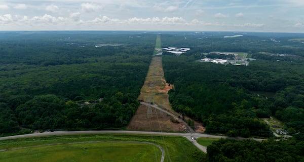 August 9, 2022 Atlanta - Aerial photograph shows the site of the proposed Atlanta public safety training center at the site of the old Atlanta prison farm in Atlanta on Tuesday, August 9 2022. Key Road shows in foreground. A growing number of southeast Atlanta neighborhoods are speaking out against the proposal to build a massive training center for police officers and firefighters on forested land in DeKalb County. (Hyosub Shin / Hyosub.Shin@ajc.com)