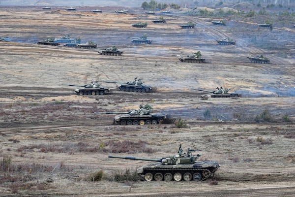 FILE - Tanks move during the Union Courage-2022 Russia-Belarus military drills at the Obuz-Lesnovsky training ground in Belarus, Feb. 19, 2022. (AP Photo/Alexander Zemlianichenko Jr., File)