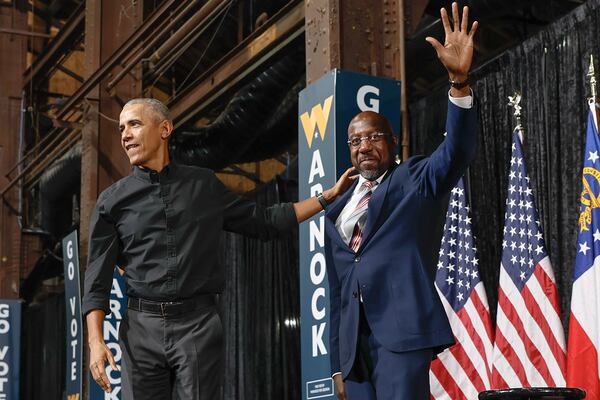 Former President Barack Obama, left, held a runoff rally to help U.S. Sen. Raphael Warnock keep the Democratic Party's base engaged. But Warnock also brought in singer Dave Matthews for a concert in Cobb County aimed at white suburban voters who occupied the middle ground. (Natrice Miller/natrice.miller@ajc.com)  