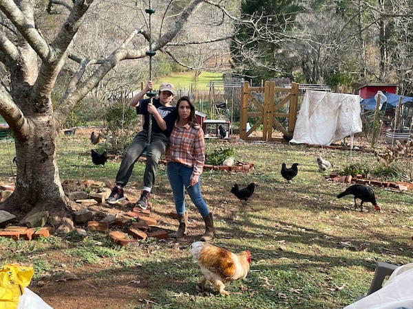 Brittany Patterson with her son, Soren, outside their home near Blue Ridge. She was arrested at her home by Fannin County deputies after Soren, now 11, walked by himself to a store about a mile away.