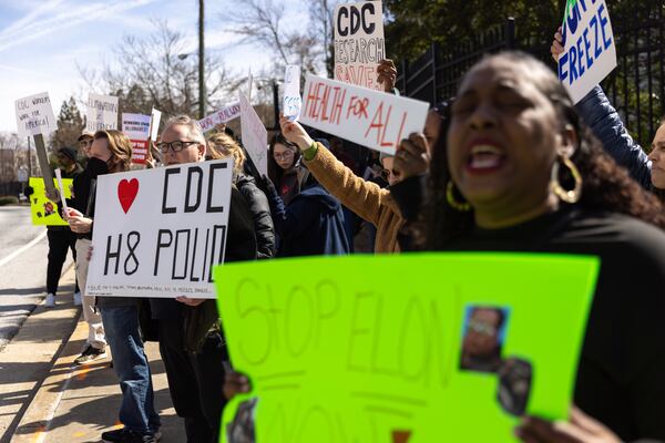 Demonstrators protest mass CDC firings outside the agency's Atlanta headquarters Tuesday.