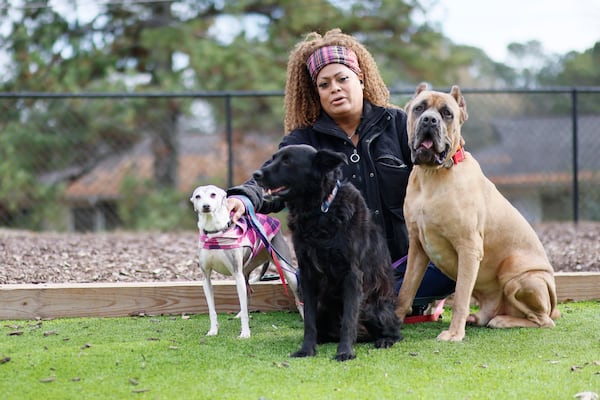 Jeniffer Arellano poses with her pets Prada, Armani, and Anubis.
 Miguel Martinez / miguel.martinezjimenez@ajc.com