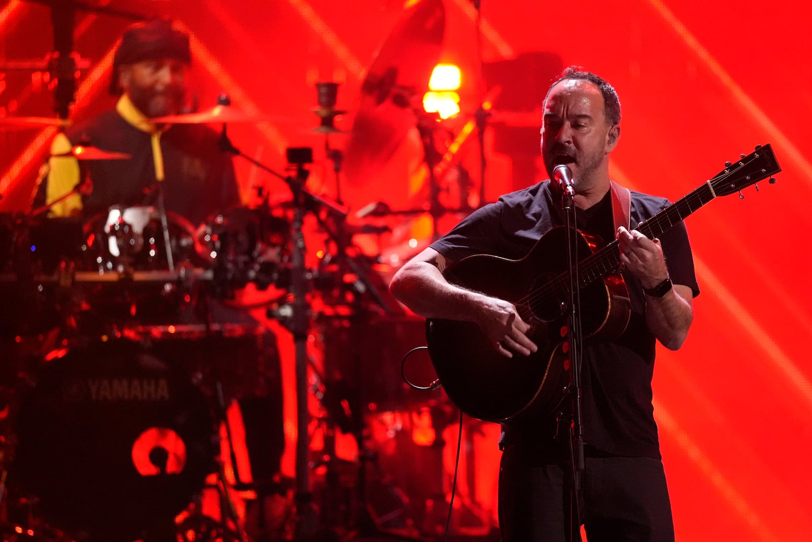 Carter Beauford, left, and Dave Matthews of the Dave Matthews band perform during the 39th Annual Rock & Roll Hall of Fame Induction Ceremony on Saturday, Oct. 19, 2024, at Rocket Mortgage FieldHouse in Cleveland. (AP Photo/Chris Pizzello)