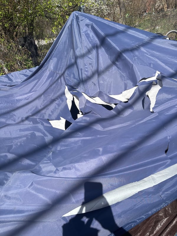 A damaged tent on Saturday, March 8, 2025, at the Old Wheat Street encampment in the Sweet Auburn neighborhood. Police have identified a suspect in the tent-slashing incident. Photo by Matt Reynolds/AJC, 2025