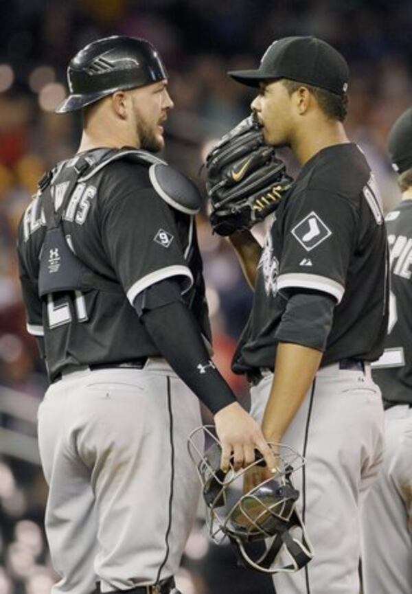 Braves free-agent signee Tyler Flowers (left) has a reputation as an outstanding pitch-framer and strong defensive catcher and game-caller. (AP file photo)