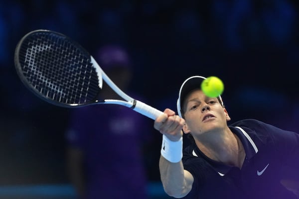 Italy's Jannik Sinner returns the ball to Russia's Daniil Medvedev during their singles tennis match of the ATP World Tour Finals at the Inalpi Arena, in Turin, Italy, Thursday, Nov. 14, 2024. (AP Photo/Antonio Calanni)