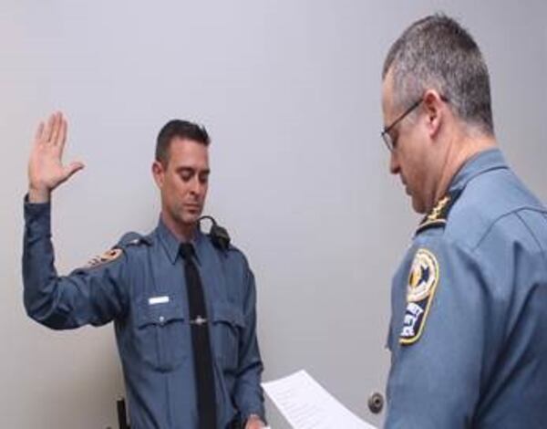 Officer George McLain, left, was injured in a helicopter crash earlier this month.