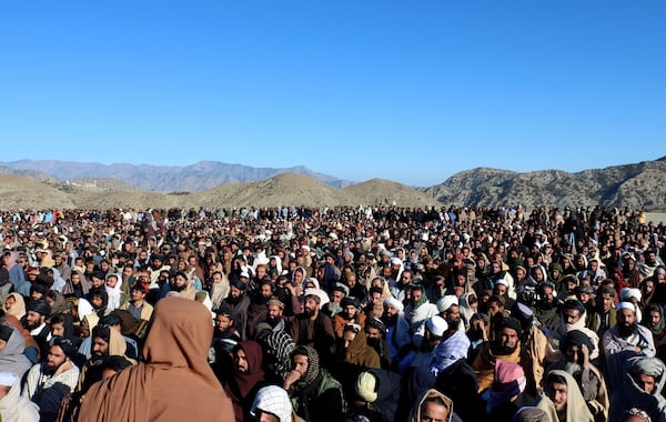 People attend the funeral prayer of Khalil Haqqani, the minister for refugees and repatriation, during his funeral procession in eastern Paktia province, Afghanistan, Thursday, Dec. 12, 2024. (AP Photo/Saifullah Zahir)