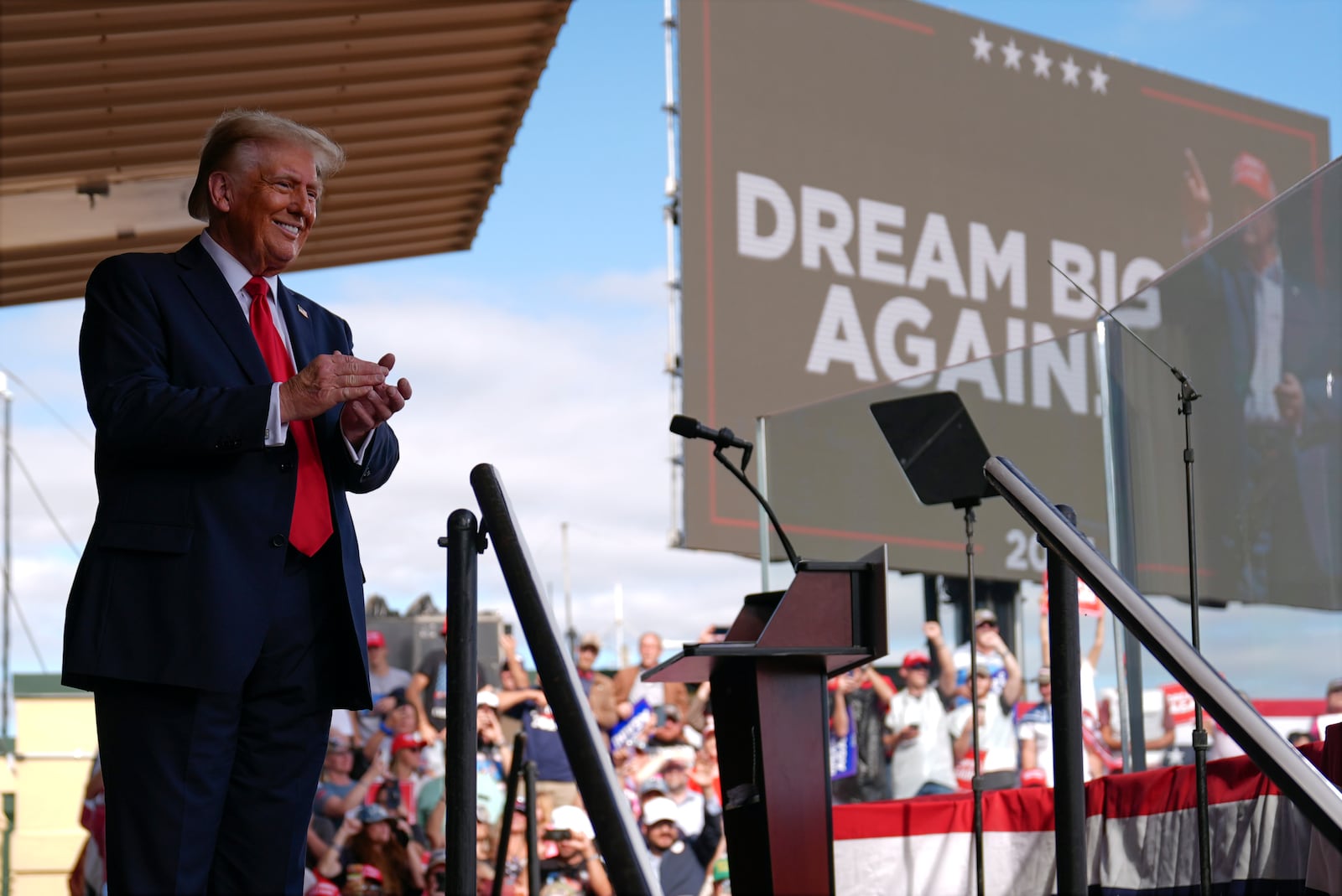 Republican presidential nominee former President Donald Trump smiles at a campaign rally at Gastonia Municipal Airport, Saturday, Nov. 2, 2024, in Gastonia, N.C. (AP Photo/Evan Vucci)