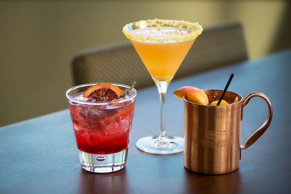  Apron and Overdrive Lounge cocktails (left to right) Ginger Thyme Blood Orange Sparkler, Whisky Daisy, and Georgia Mule. Photo credit- Mia Yakel.