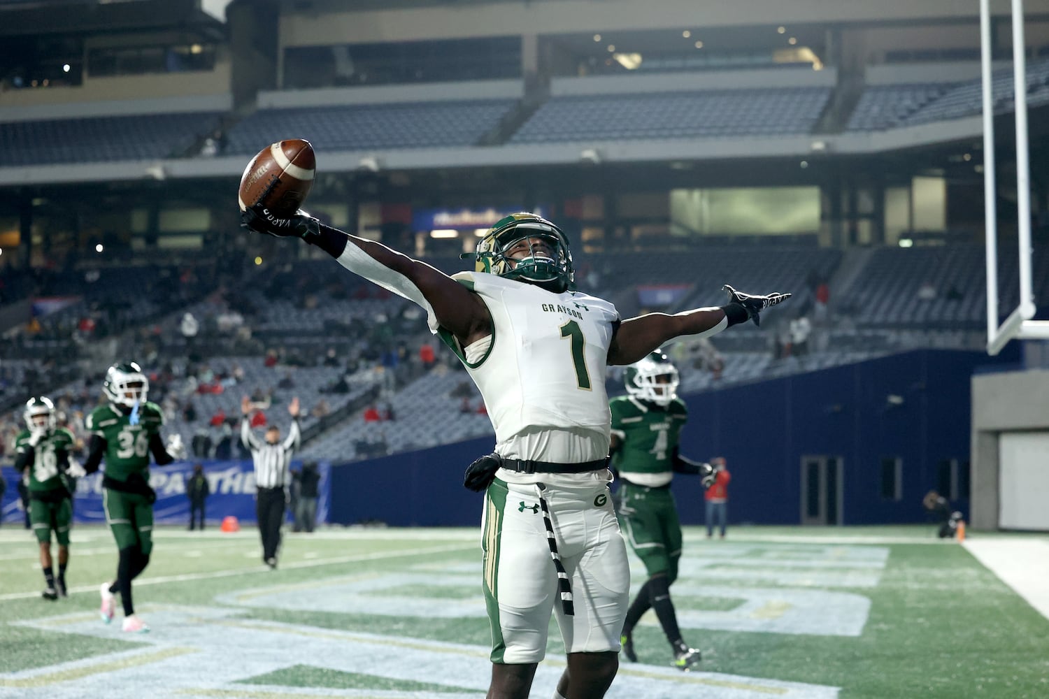 Dec. 30, 2020 - Atlanta, Ga: Grayson wide receiver Jamal Haynes (1) celebrates after catching a touchdown pass from quarterback Jake Garcia (not pictured) in the first half against Collins Hill during the Class 7A state high school football final at Center Parc Stadium Wednesday, December 30, 2020 in Atlanta. JASON GETZ FOR THE ATLANTA JOURNAL-CONSTITUTION