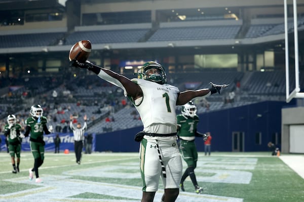 Grayson wide receiver Jamal Haynes (1) celebrates after catching a touchdown pass from quarterback Jake Garcia in the first half against Collins Hill in the Class 7A football final Wednesday, Dec. 30, 2020, at Center Parc Stadium in Atlanta. (Jason Getz/For the AJC)