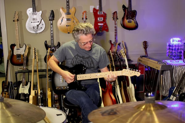 Ed Roland has more than 150 guitars in his impressive collection. Photo: Melissa Ruggieri/AJC