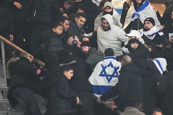 Fans argue on stands during the UEFA Nations League soccer match between France and Israel at the Stade de France stadium in Saint-Denis, outside Paris, Thursday Nov. 14, 2024. (AP Photo/Thibault Camus)