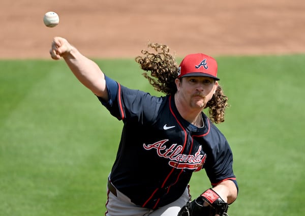 Braves pitcher Grant Holmes throws a live batting practice session in North Port, Fla. 