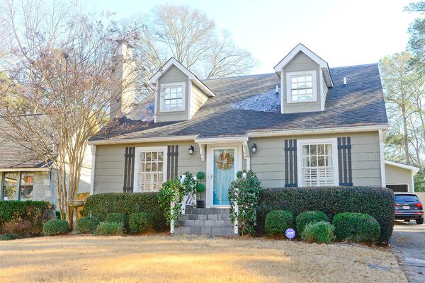 Katie and Todd Luepke's Cape Cod-style home may look small from the outside, but "It really opens up when you walk in the door.  It is kind of our little secret," Katie Luepke said. The house is one of five featured on the Young Collectors' Home Tour.