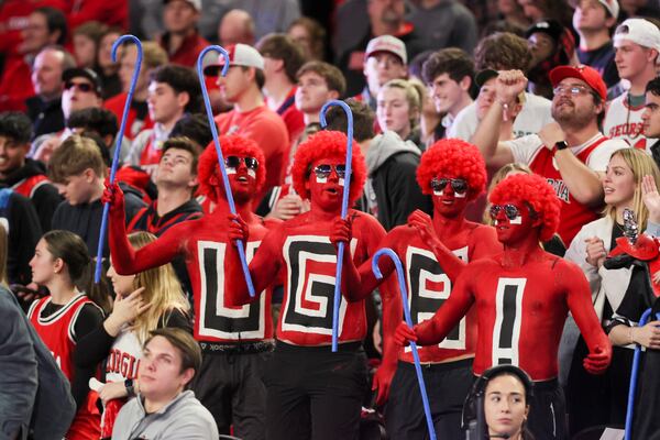 Georgia fans hold blue canes during Georgia’s game against Kentucky in the first half in a NCAA men’s basketball game at Stegeman Coliseum, Tuesday, Jan. 7, 2025, in Athens, Ga. Georgia defeated Kentucky 82-69. (Jason Getz / AJC)
