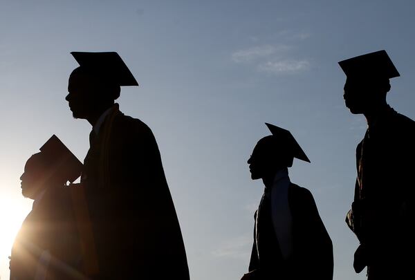 Morehouse College graduates walk to Morehouse’s 132nd commencement ceremony, Sunday, May 15, 2016, in Atlanta. 