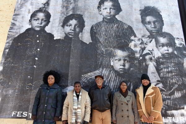 Sabrina Strickland (from left), Sarah Nuckles, Charles Grogan, Veronica Ellis and Jamal Goodman are descendants of the Brown family, whose circa 1895 photograph was transformed into a mural at the corner of Elizabeth Way and Canton Street in Roswell. The family fled racial tensions in Forsyth County to settle in Roswell, Marietta and surrounding environs. HYOSUB SHIN / HSHIN@AJC.COM