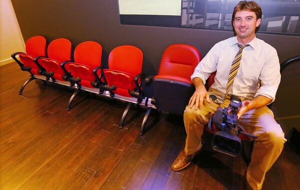 060215 ATLANTA: Reporter Will Frampton, CBS 46, trys out a club seat sample next to some regular seats during a tour of the New Stadium Preview Center while the Falcons launch personal seat license sales for approximately 60,000 non-club seats following the GWCCA board vote on the pricing plan on Tuesday, June 2, 2015, in Atlanta. Curtis Compton / ccompton@ajc.com