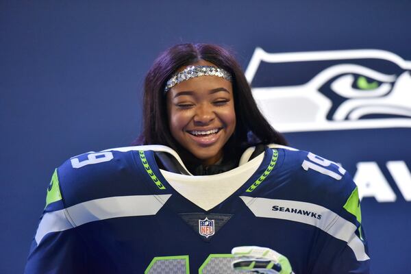 Jordyn Gruber poses during the Super Bowl Experience in the Georgia World Congress Center on Saturday.HYOSUB SHIN / HSHIN@AJC.COM