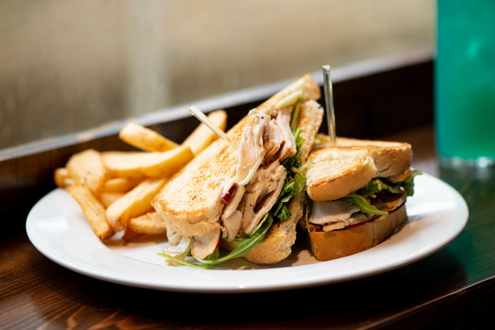 Warm Smoked Turkey Sandwich with apple and brie, arugula, toasted sourdough, and cranberry dijon mustard. Photo credit- Mia Yakel.