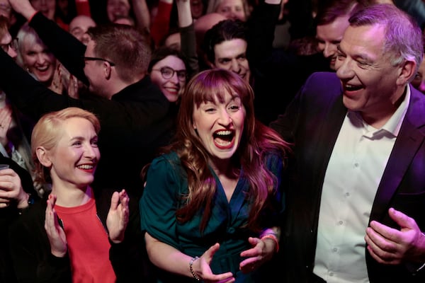 From left, Ines Schwerdtner, co-leader of the Left Party (Die Linke), top candidate Heidi Reichinnek and Jan van Aken, co-leader of the Left Party (Die Linke) react during the party's election party in Berlin, Germany, Sunday, Feb. 23, 2025. (Carsten Koall/dpa via AP)