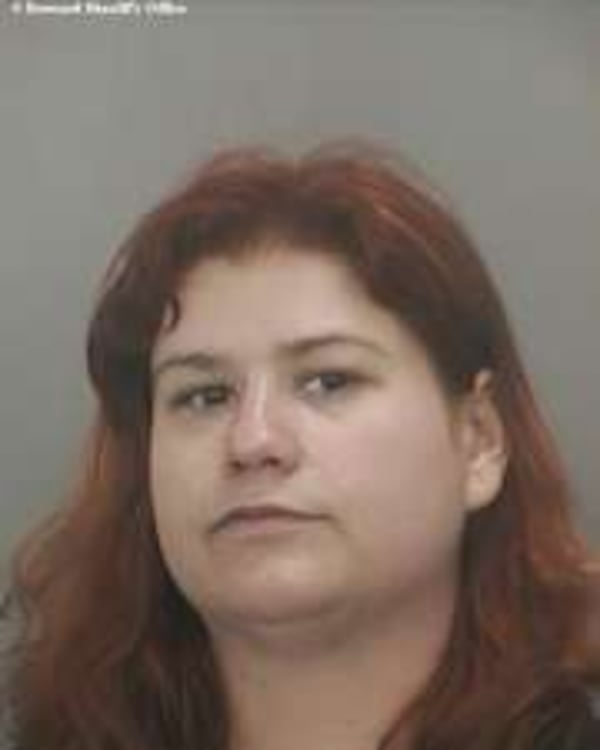 Kayla Ann Aubart, in police booking photo after an arrest in Florida in 2013.