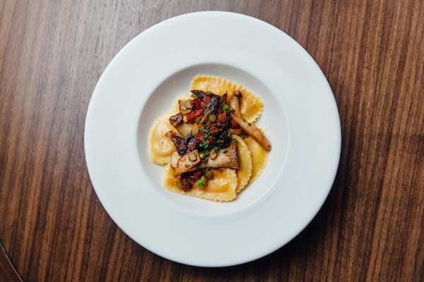 Burrata Ravioli with seasonal wild mushroom and asparagus confetti. Credit: Justen Clay