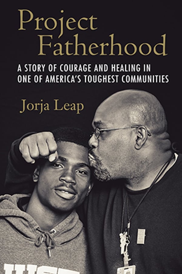 Jorja Leap’s “Project Fatherhood” is a culmination of four years of conversations and weekly meetings with the fathers of Jordan Downs that reflect the authentic experiences of these men as they navigate parenthood. (Photo courtesy Beacon Press/TNS)